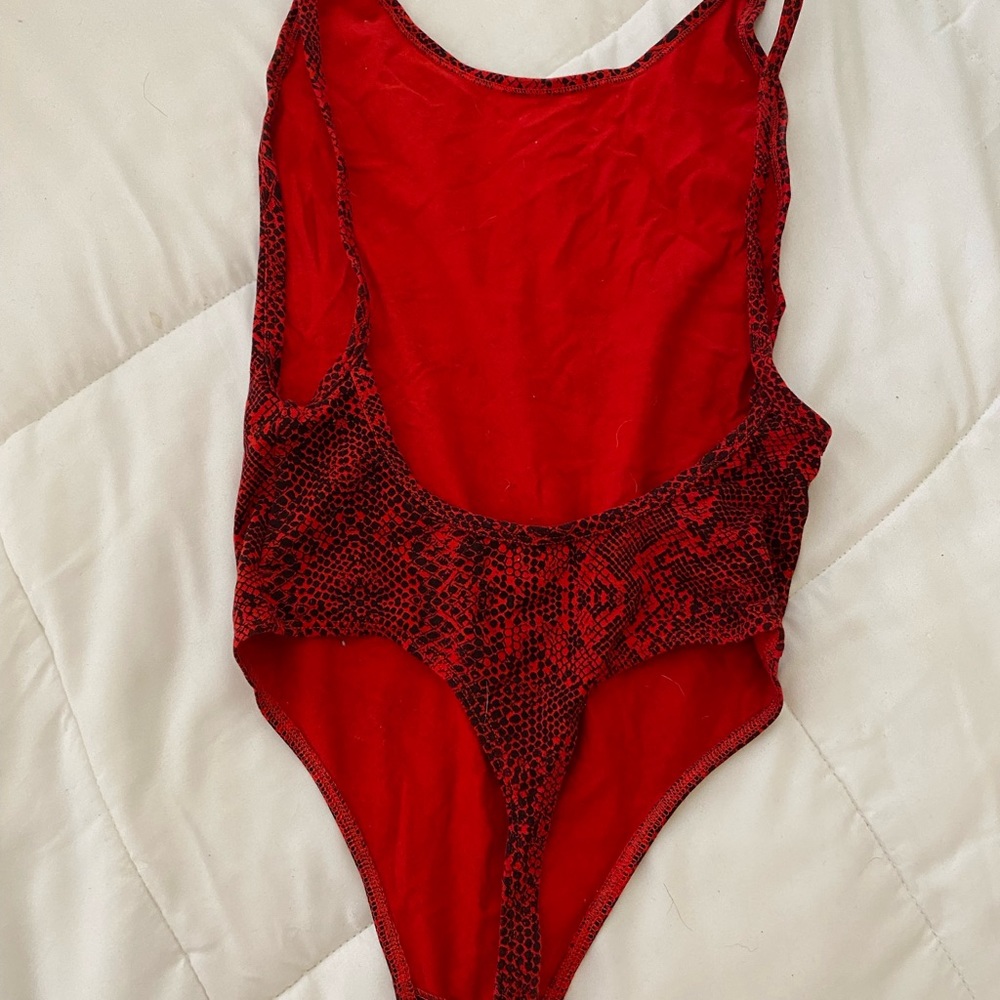Sexy, body-hugging Tna Bodysuit in XS.